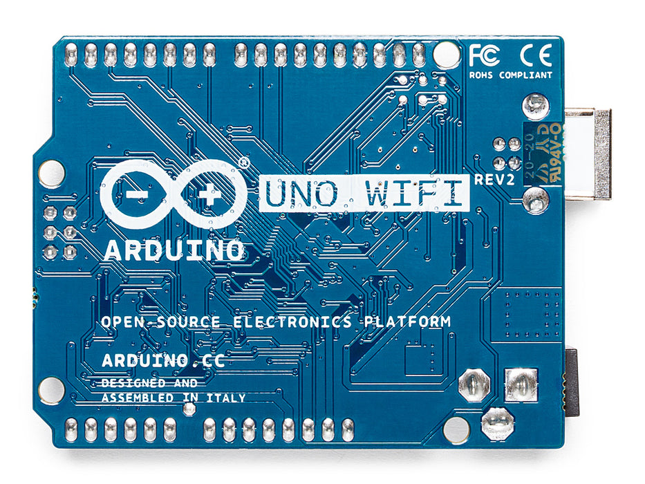 Arduino Uno WiFi Rev2 板的背面視圖,顯示了藍色 PCB 背面的焊盤、電路走線和絲網標籤。
