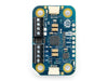 Top down view of the Arduino Modulino Motors module, showing the central motor driver chip and plug-and-play connectors on a compact circuit board.