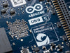 Close-up of an Arduino Uno Q board with Qualcomm Dragonwing logo.
