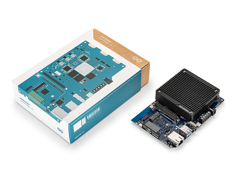 Unboxed view of the Arduino VENTUNO Q, showing its retail box beside the assembled board with a black heatsink and connector pins.