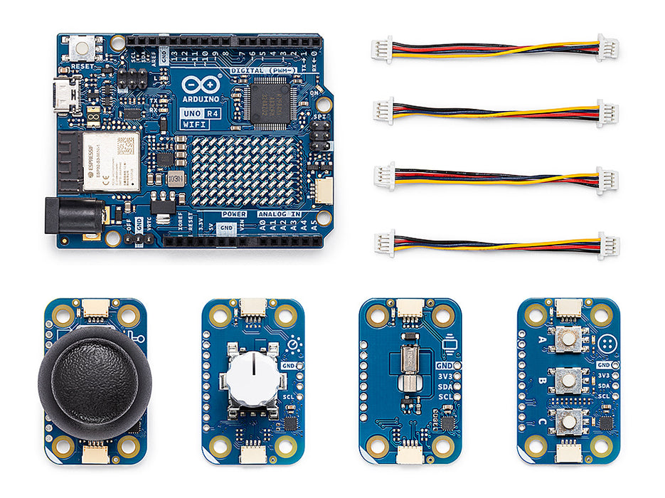 Electronic components including a microcontroller board, sensors, and cables on a white background