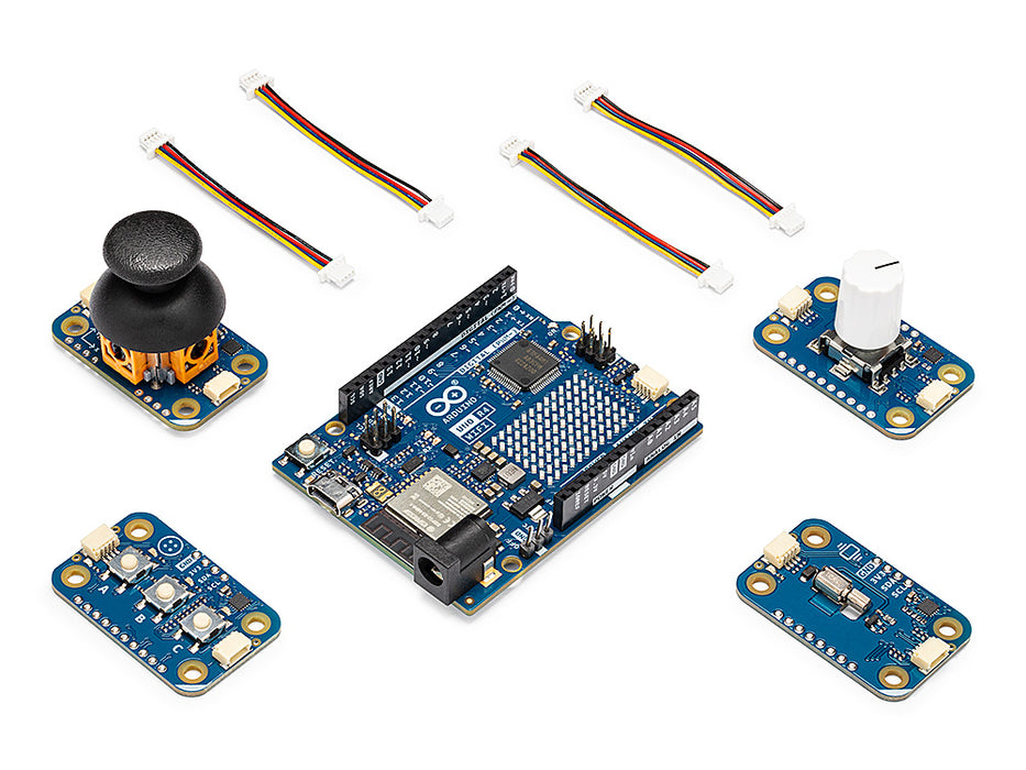 Collection of electronic components including a joystick, sensor boards, and connectors on a white background